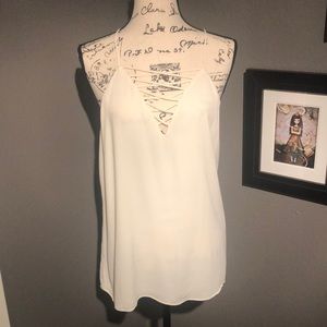 Flowing lined spaghetti strap cream shirt